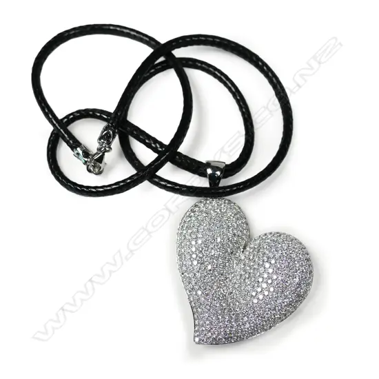 An 18ct white gold diamond heart shaped pendant,