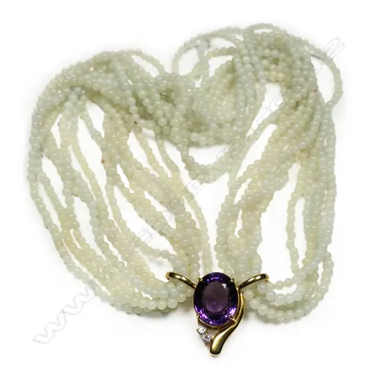 A jadeite bead necklace with 18ct gold amethyst and diamond enhancer,