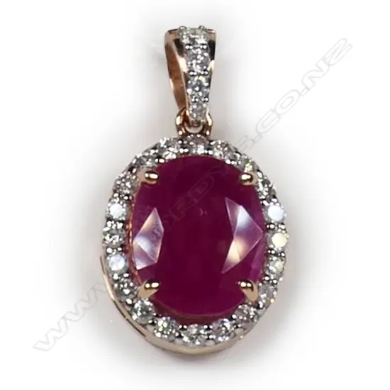 A 14ct rose gold ruby and diamond halo pendant,