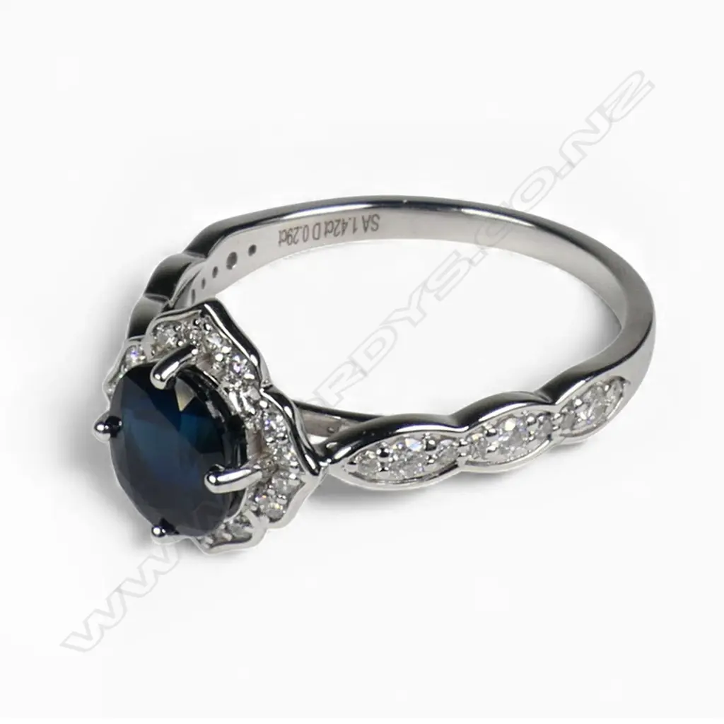 A 14ct white gold sapphire and diamond ring, Image 1++