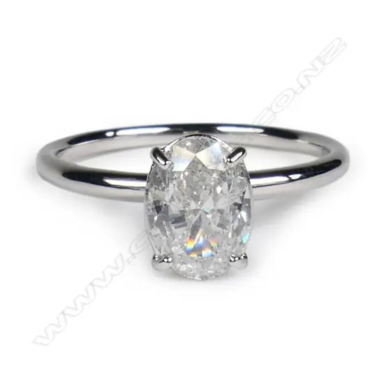 A 14ct white gold and diamond solitaire ring,