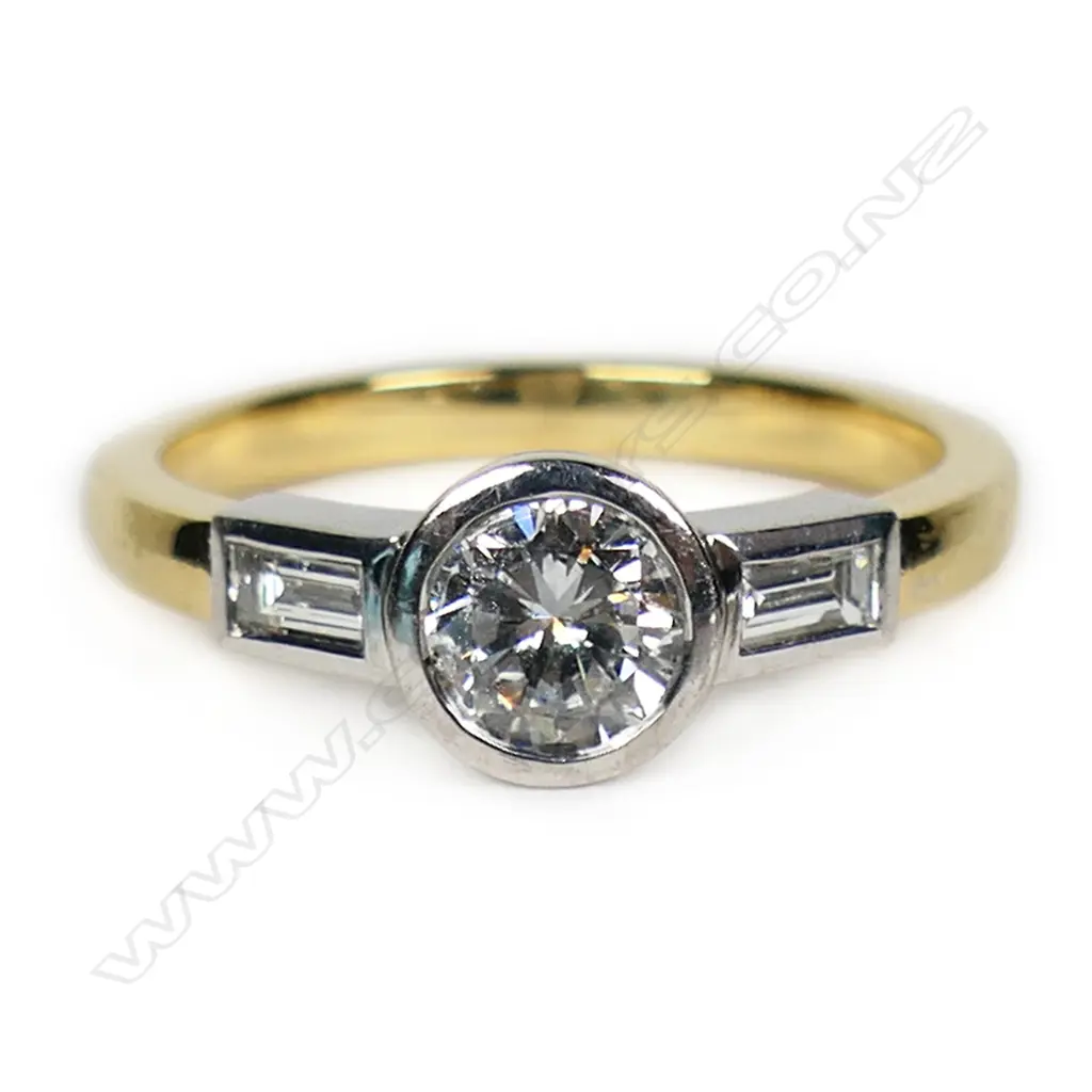 An 18ct white and yellow gold diamond solitaire ring, Image 1++