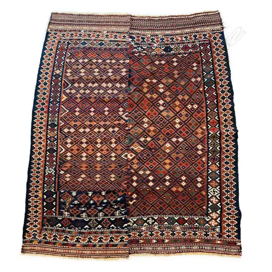 An early 20thC handwoven Caucasian rug,