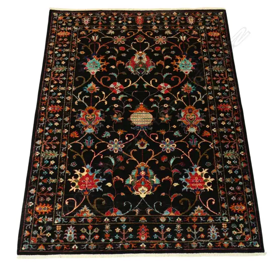 A hand-knotted Chobi rug,