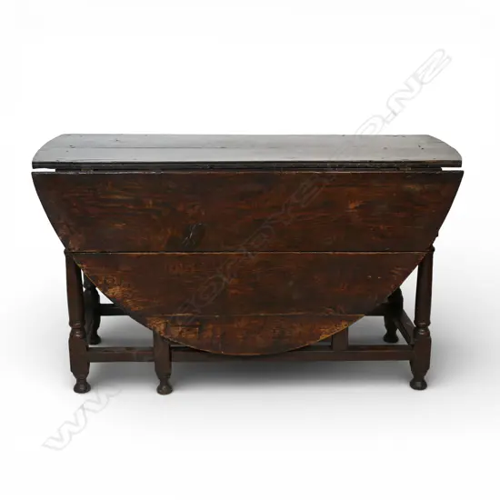 A substantial Georgian oak large country gate leg table,