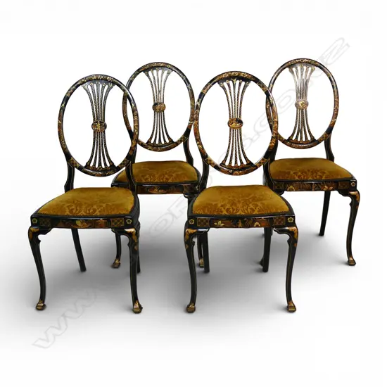 A set of four ebonised dining chairs,