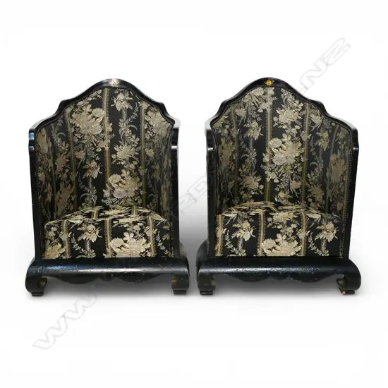A pair of unusual ebonised tub chairs,