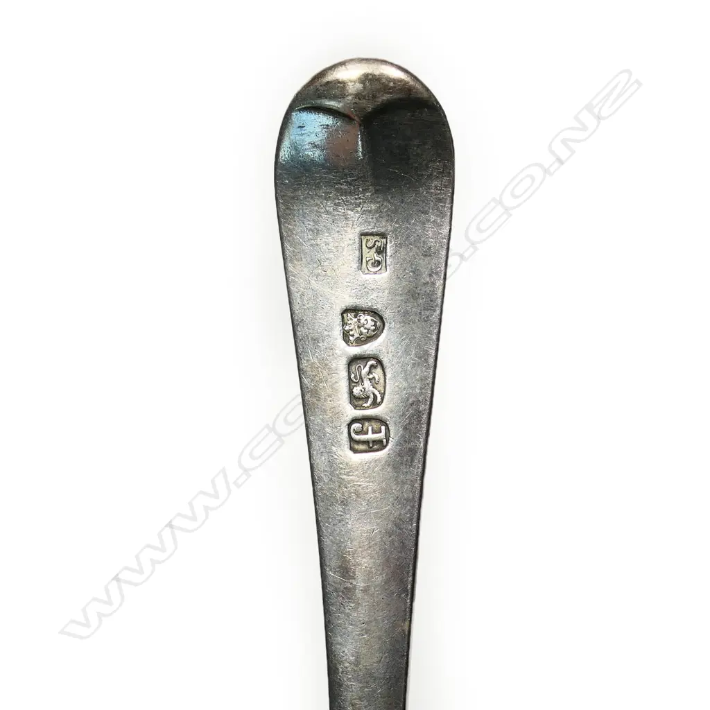 A George III silver feather edged table spoon, Image 1++