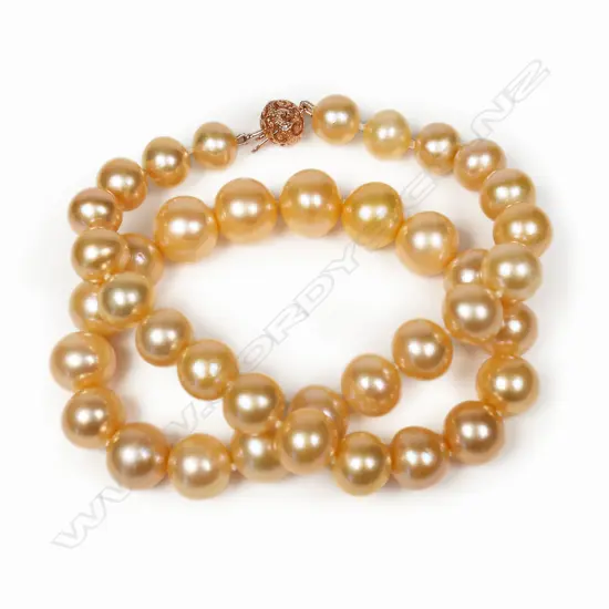 A necklace of golden peach cultured fresh water pearls,