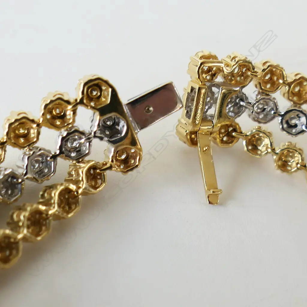 An 18ct white gold white and yellow diamond three strand bracelet, Image 1++