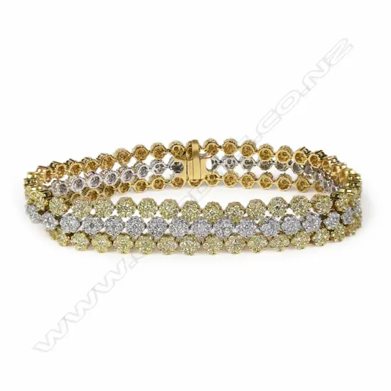 An 18ct white gold white and yellow diamond three strand bracelet,