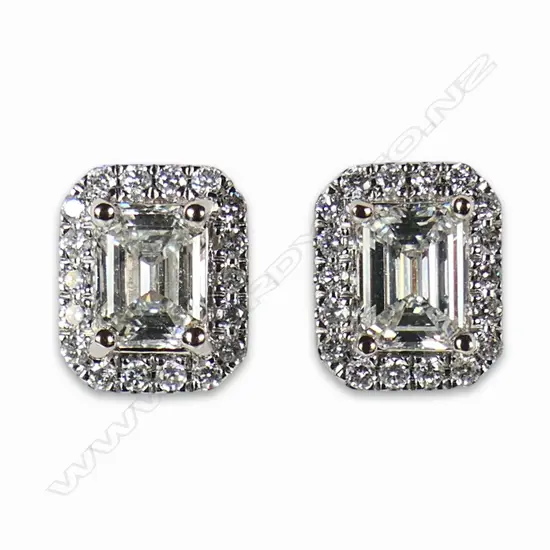 A pair of 18ct white gold and diamond stud earrings,
