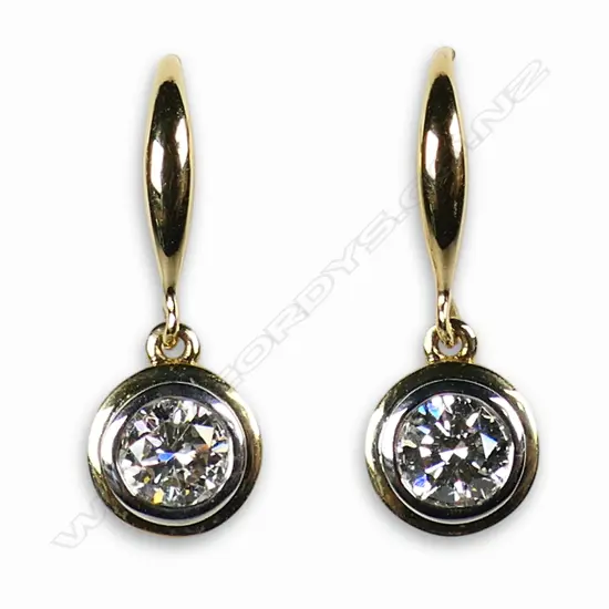 A pair of 18ct yellow and white gold and diamond drop earrings,