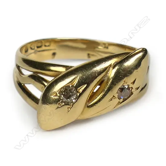 An early 20thC 18ct yellow gold and diamond snake ring,