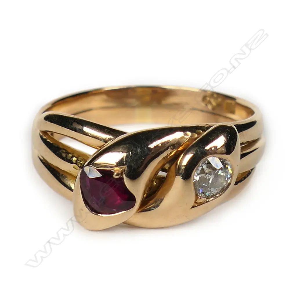 An 18ct rose gold diamond and ruby double headed snake ring, Image 1++
