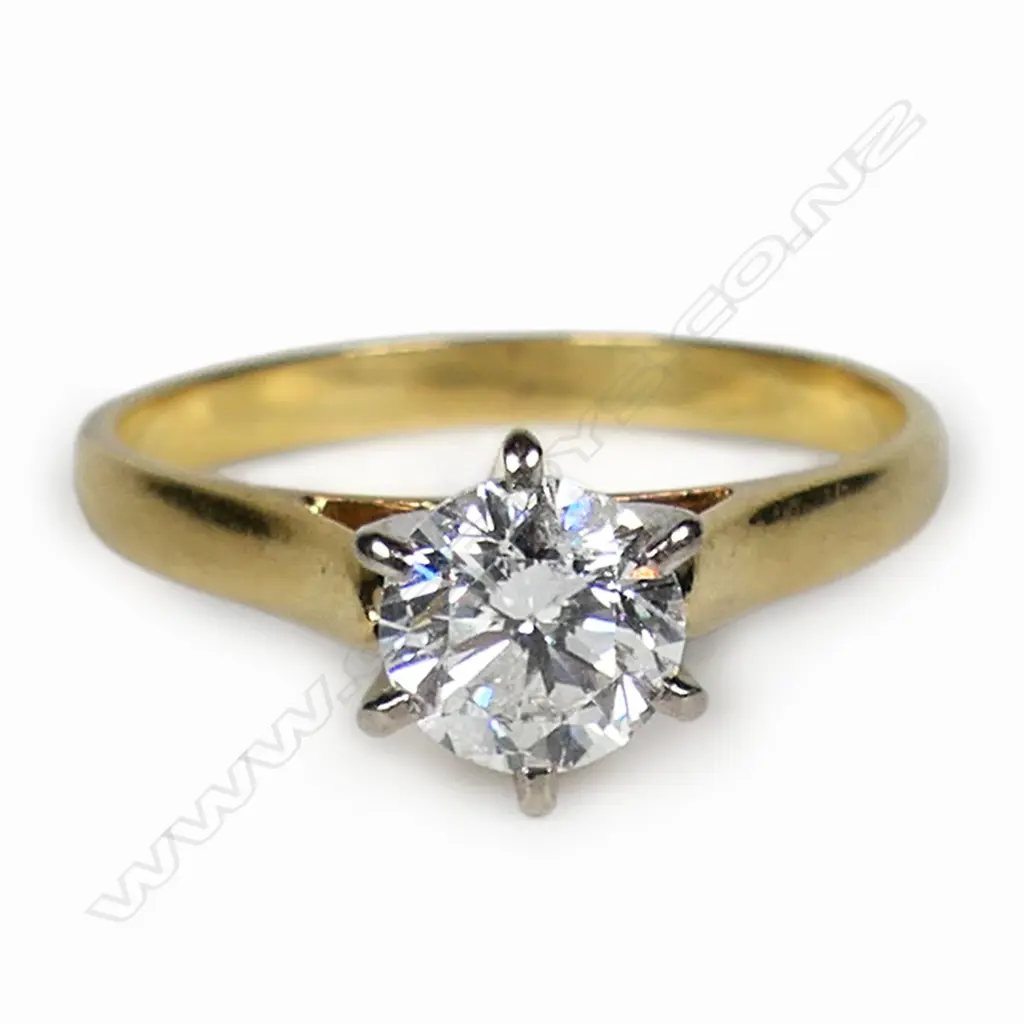 An 18ct gold and diamond solitaire ring, Image 1++