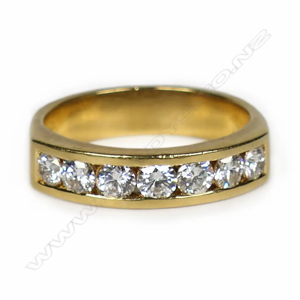 An 18ct gold and diamond set band, Image 1++