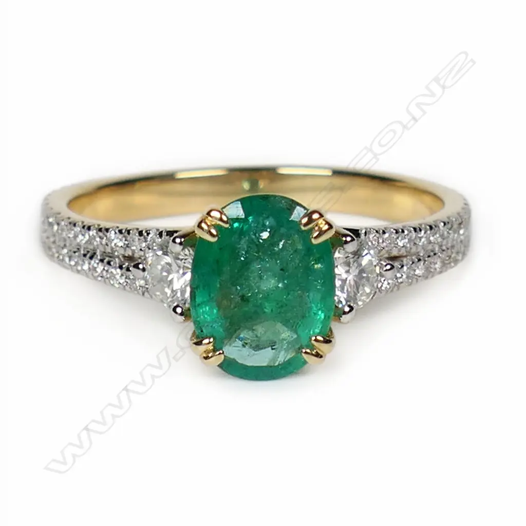 A 14ct gold emerald and diamond dress ring, Image 1++