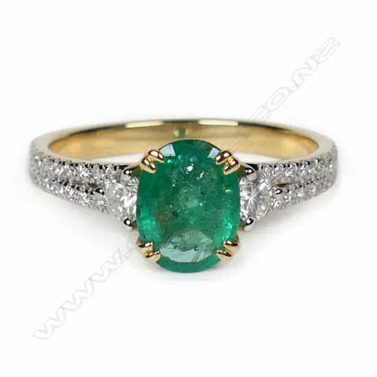 A 14ct gold emerald and diamond dress ring,