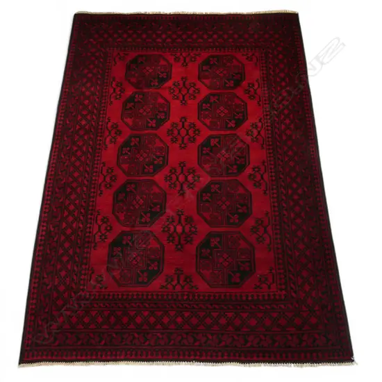 A hand-knotted elephant foot rug,