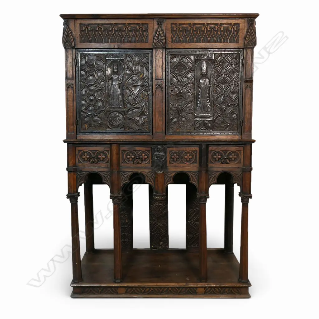 An uncommon and very decorative 19thC oak carved ecclesiastical carved cupboard on raised stand, Image 1++