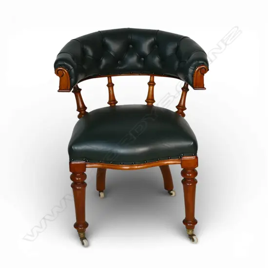 A good colonial kauri and green leather captain's tub chair,
