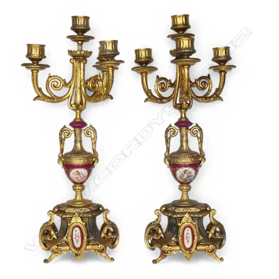 A pair of turn of the century ormolu and porcelain candelabra,