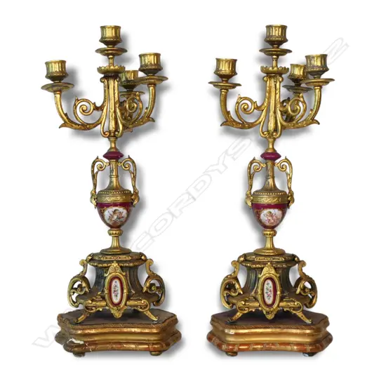A pair of turn of the century ormolu and porcelain candelabra,
