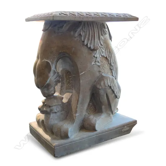 A large variegated tan marble sculptured stand,