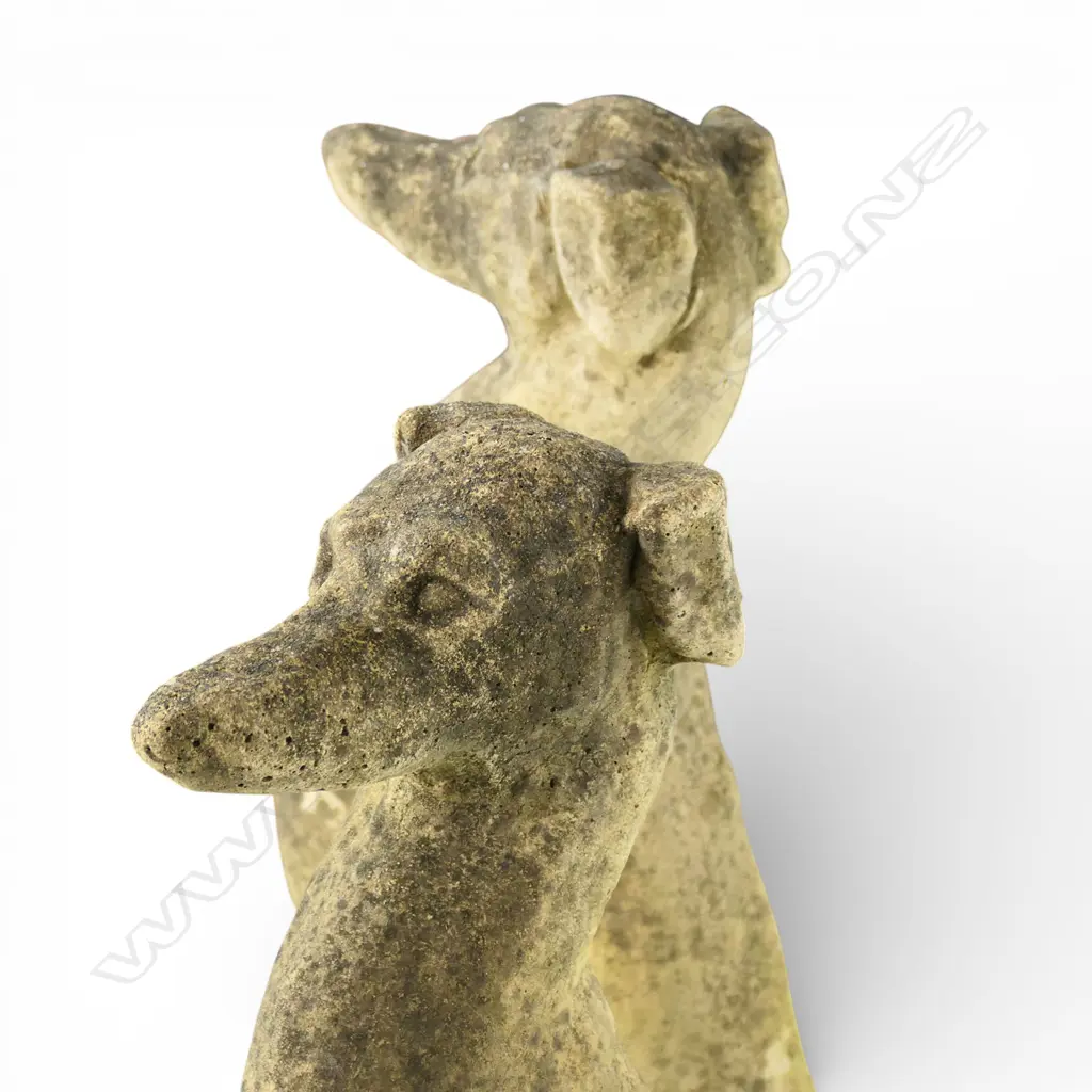 A pair of classical Church Stone greyhounds, in seated position, on small plinth base, weathered patina. H.750mm. Image 1++