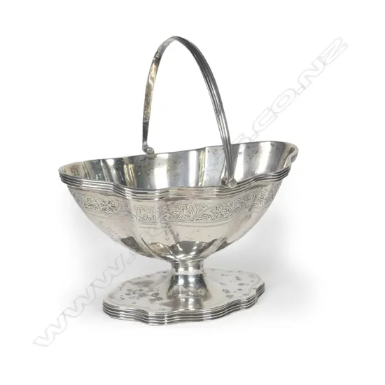 An early 20thC silver pedestal swing handled sugar bowl