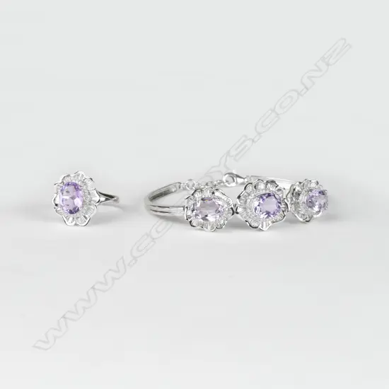 A modern 18ct. white gold amethyst and diamond ring and matching bracelet