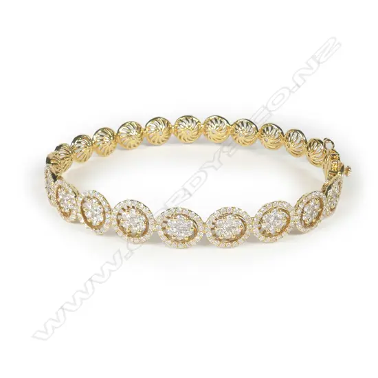 An 18ct gold and diamond hinged bangle