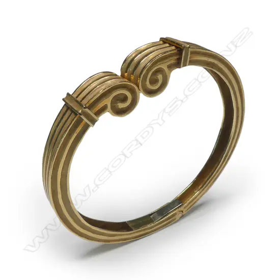 An 18ct gold Greek style hinged bangle
