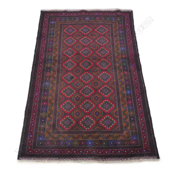 A hand-knotted Baluchi rug