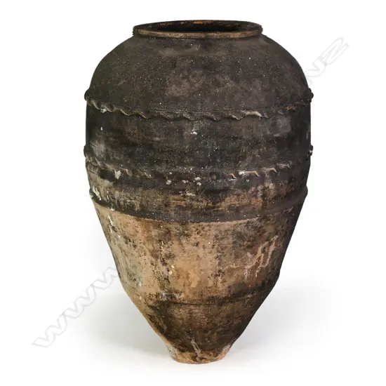 An old European terracotta tall olive oil storage jar