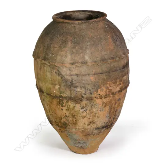An old European terracotta tall olive oil storage jar