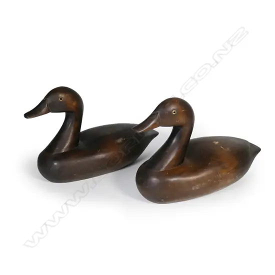 A pair of handmade carved wood display duck decoys