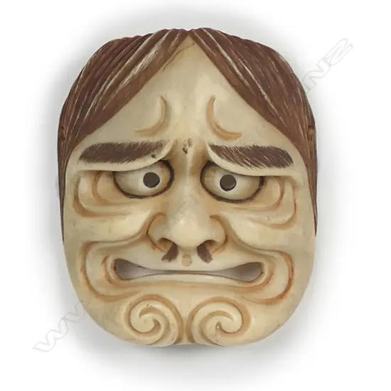 A Japanese carved ivory miniature Noh mask