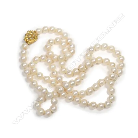 A cultured pearl necklace with 14ct gold clasp, a single strand of ninety-five 7.8mm uniform round deep cream pearls, the 14ct gold clasp in the form of a lion’s head with diamond eyes.