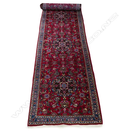 A long Persian Kashan runner