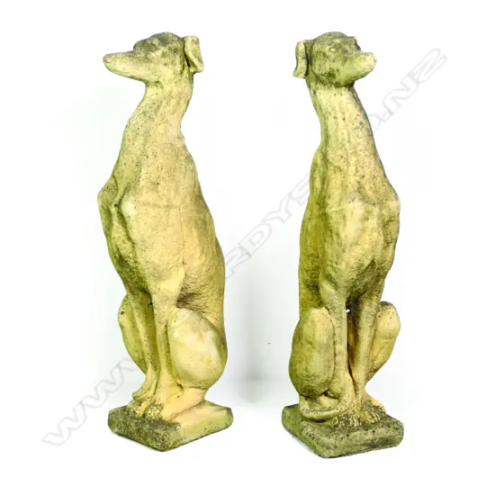 A pair of church stone greyhounds