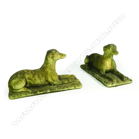 A pair of church stone greyhounds