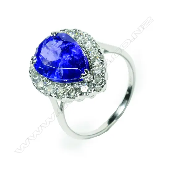 A 14ct white gold tanzanite and diamond halo ring