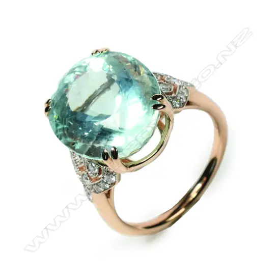 A 14ct rose gold aquamarine and diamond ring