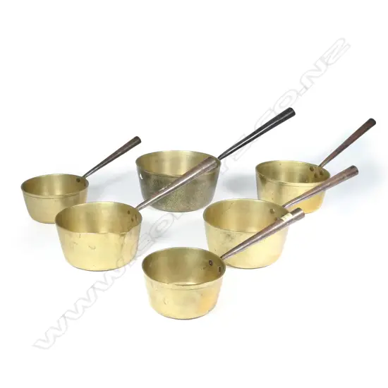 A graduated set of six Victorian brass cooking pots