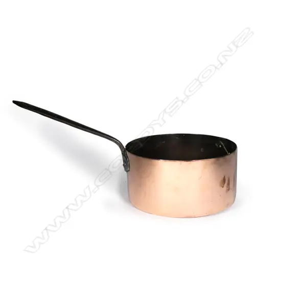 A large Victorian copper saucepan