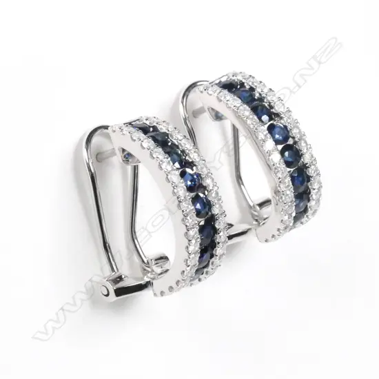 A pair of 14ct white gold sapphire and diamond earrings