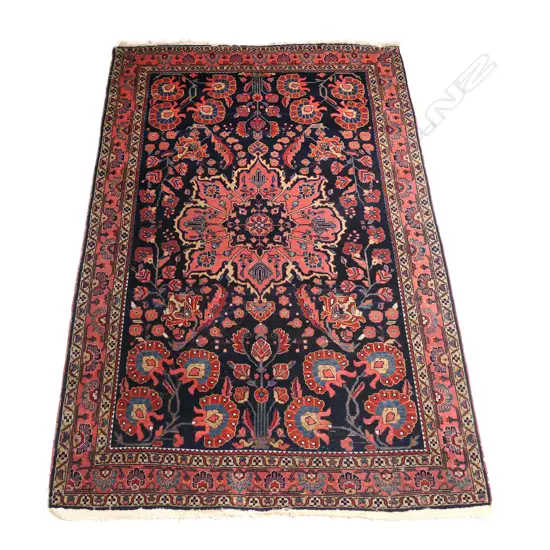 A vintage hand knotted Persian rug