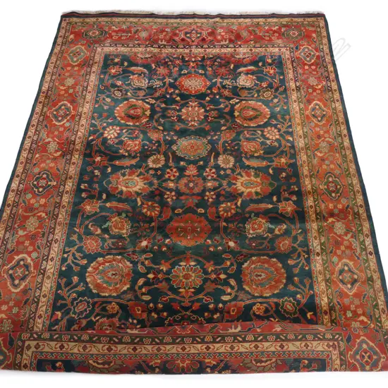 A large Persian hand knotted carpet